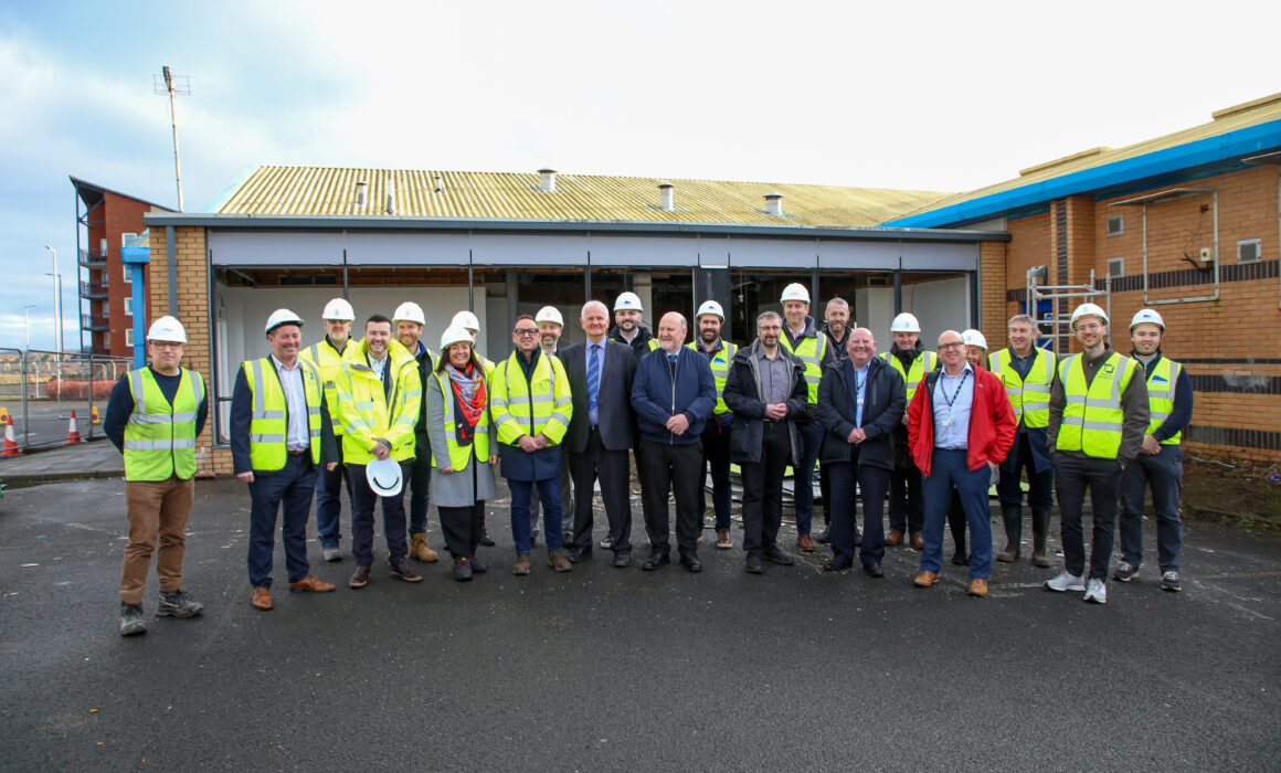 The project Team and councillors in front of of Troon Leisure Club, with wall torn down